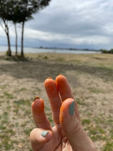 Orange fingers from eating Flamin' Hot Cheetos
